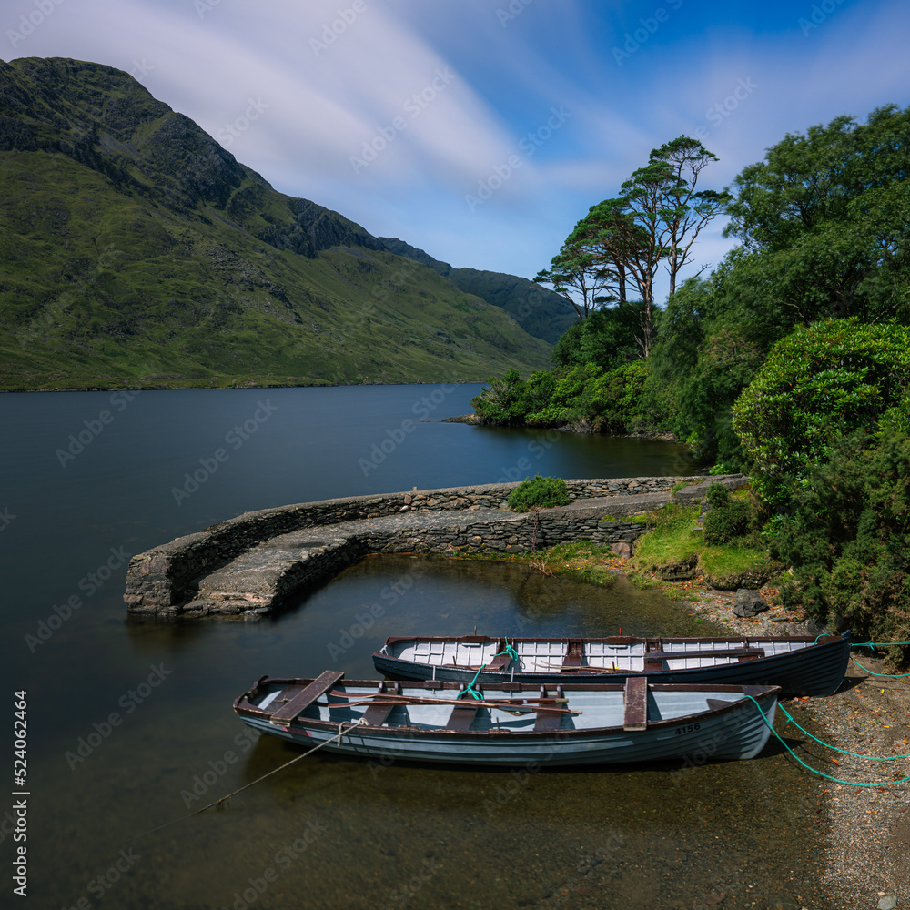 Boats tied at Lough Harbour in County Mayo Ireland