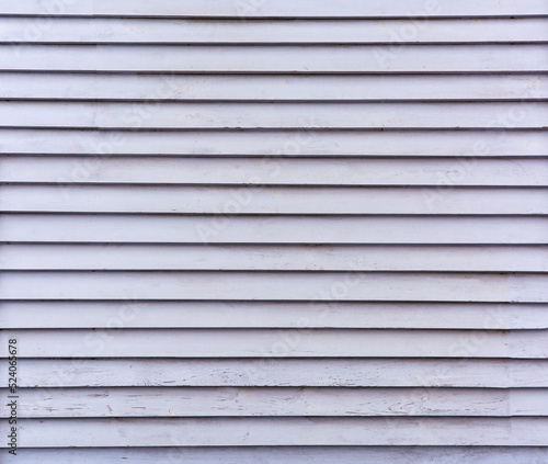 Solid background of wooden white planks. Straight horizontal lines of boards. Background from flat straight boards