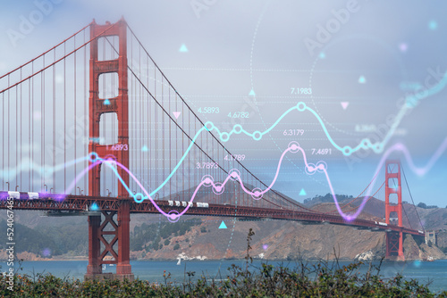 Iconic view of the Golden Gate Bridge from South side, day time, San Francisco, California, United States. Forex graph, charts hologram. Concept of internet trading, brokerage, fundamental analysis photo