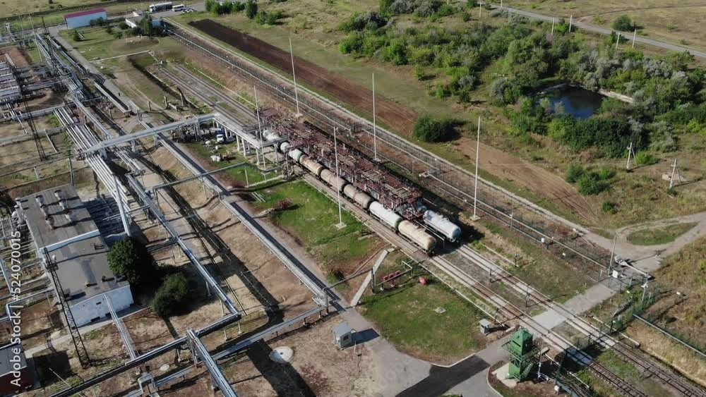 HD. Bird's-eye view. Modern equipment with a pipe or a powerful technological zone at an oil depot or tank farm. Extraction of rock oil for supplies. HD. Bird's-eye view. Modern equipment with a pipe or a powerful technological zone at an oil depot or tank farm. Extraction of rock oil for supplies.