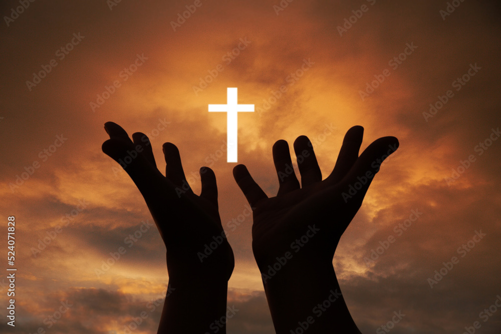 Person human hands open palm up worship or pray for god. background is sunrise. Concept for Christian, Christianity, Catholic religion, divine, heavenly, celestial or god.