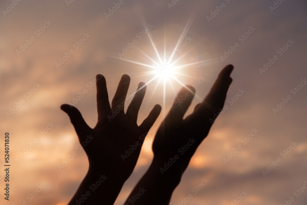 Person human hands open palm up worship or pray for god. background is sunrise. Concept for Christian, Christianity, Catholic religion, divine, heavenly, celestial or god. - obrazy, fototapety, plakaty 