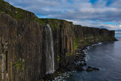Aerial view of Kilt Rock & Mealt Falls cascading into the ocean on the Isle of Sky in Scotland