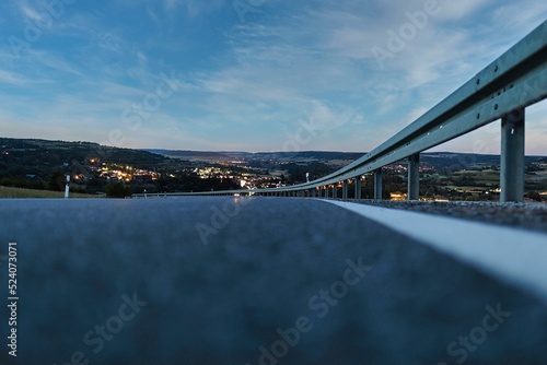 Ground level shot of the road against the cityscape photo