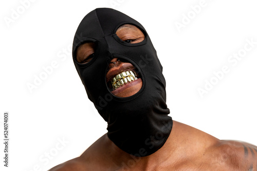 Photos Shirtless tattooed African American man with black mask and gold fangs