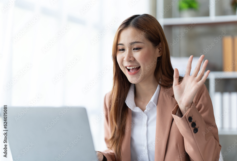 Asian woman working with laptop in her office. business financial concept. Asian woman working with laptop in her office. business financial concept.