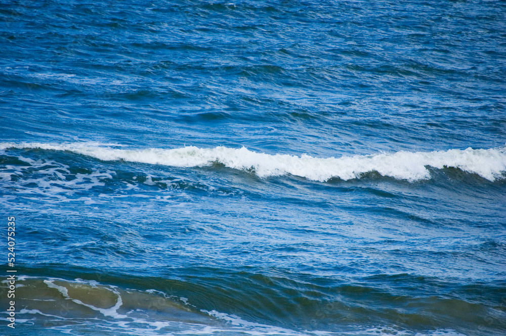 View of the waves on the seashore.