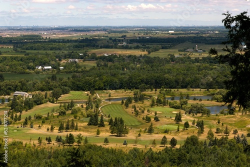 View of Milton, Ontario with landscaped pond, green grass meadows, from Mount Nemo Conservation Area photo