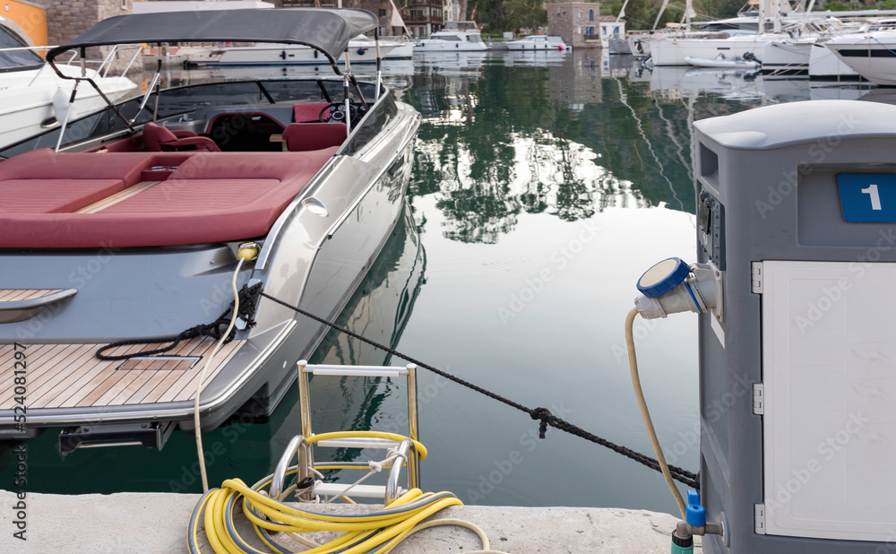 Charging station for boats, electrical outlets to charge ships in