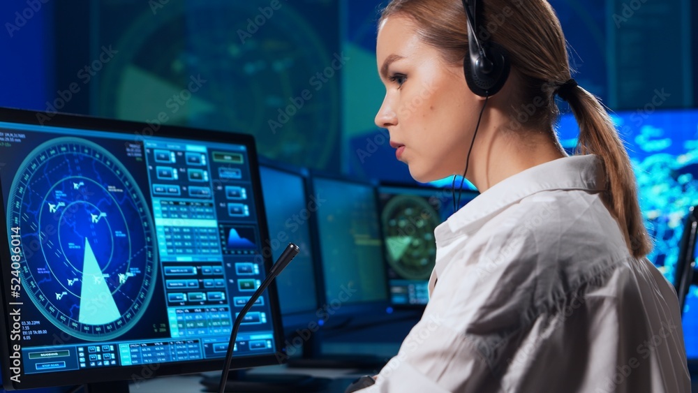 Workplace of the air traffic controllers in the control tower. Team of professional aircraft control officers works using radar, computer navigation and digital maps. Aviation concept. Workplace of the air traffic controllers in the control tower. Team of professional aircraft control officers works using radar, computer navigation and digital maps. Aviation concept.