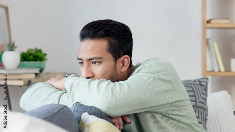 Sad, depressed and unhappy young man reading bad news on his phone. Man feeling stressed, worried and anxious at home. Casual guy in stress, anxiety and worried about health. Sad, depressed and unhappy young man reading bad news on his phone. Man feeling stressed, worried and anxious at home. Casual guy in stress, anxiety and worried about health.