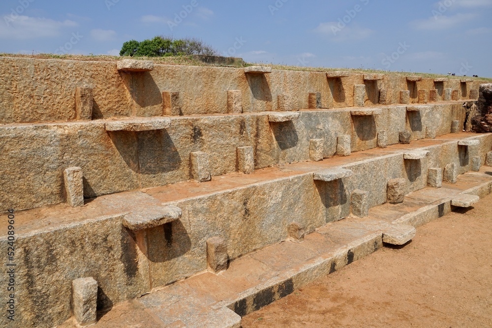 Ruins of ancient abandoned structure of 7th Century A.D. Historical destroyed built structure of ancient heritage landmark site in Mahabalipuram, Tamilnadu, India.