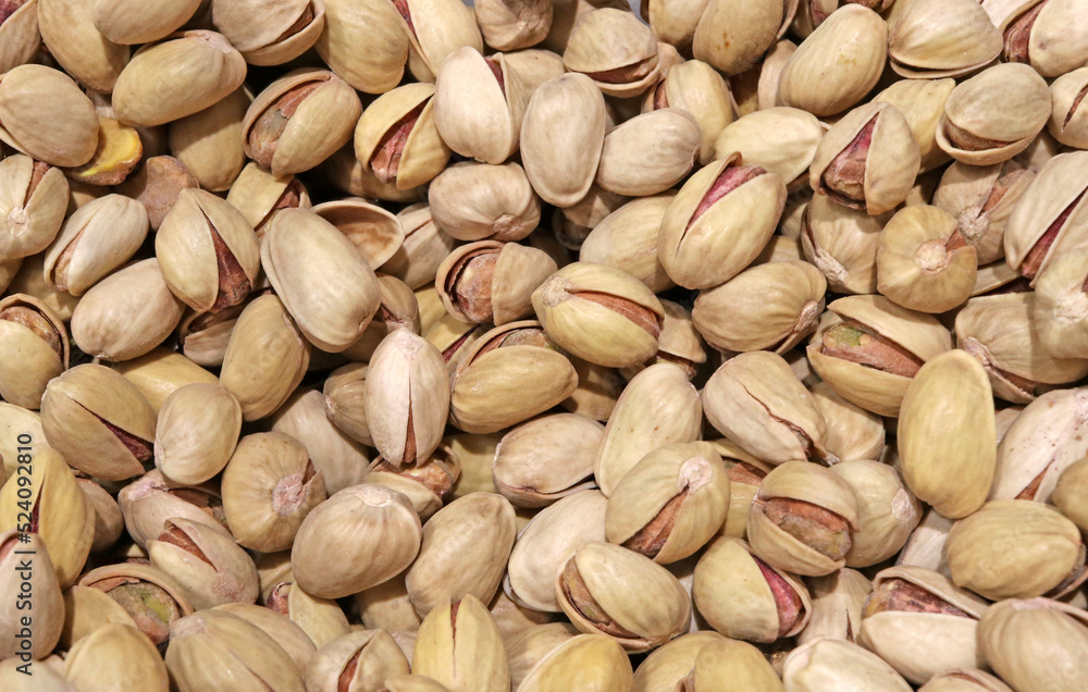 Lots of pistachios with their shell