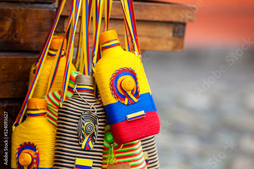 Liquor bottles normally used for traditional aguardiente decorated with the colors of the Colombian flag photo