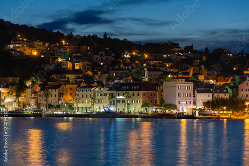 Evening city of Split in Croatia, reflection of the lights of the night city. © ArturSniezhyn