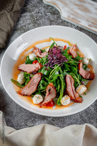 Smoked duck breast salad with vegetables and spices