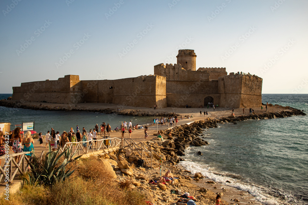 Le Catella, Calabria, Italy, sunset on the beach and castle