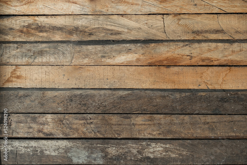 detailed view of orange wood plank background. wall of a low income house. texture for door or wall of a forest cabin. cabinetmaking concept. wood plank gradient.