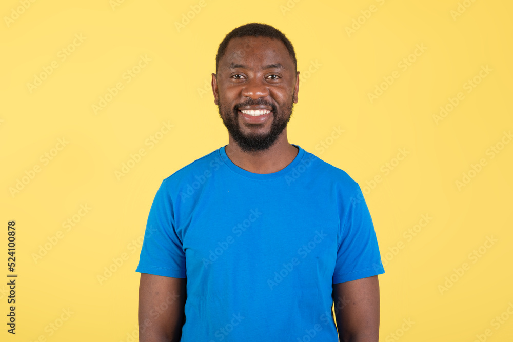 Portrait Of Toothy African American Guy Posing Over Yellow Background Portrait Of Toothy African American Guy Posing Over Yellow Background