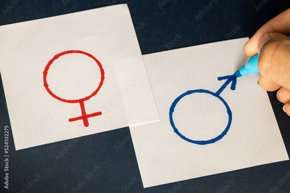 hand-painted on white pages symbols of gender, Woman and man, symbol of ...