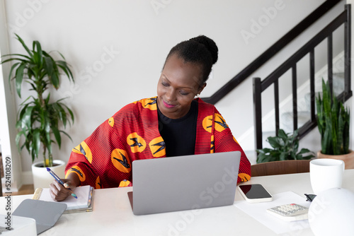 Woman working from home photo
