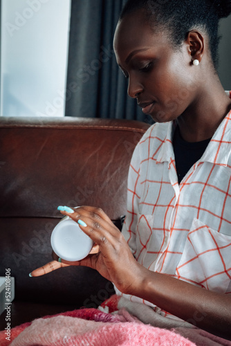 Woman getting painkiller medication at home