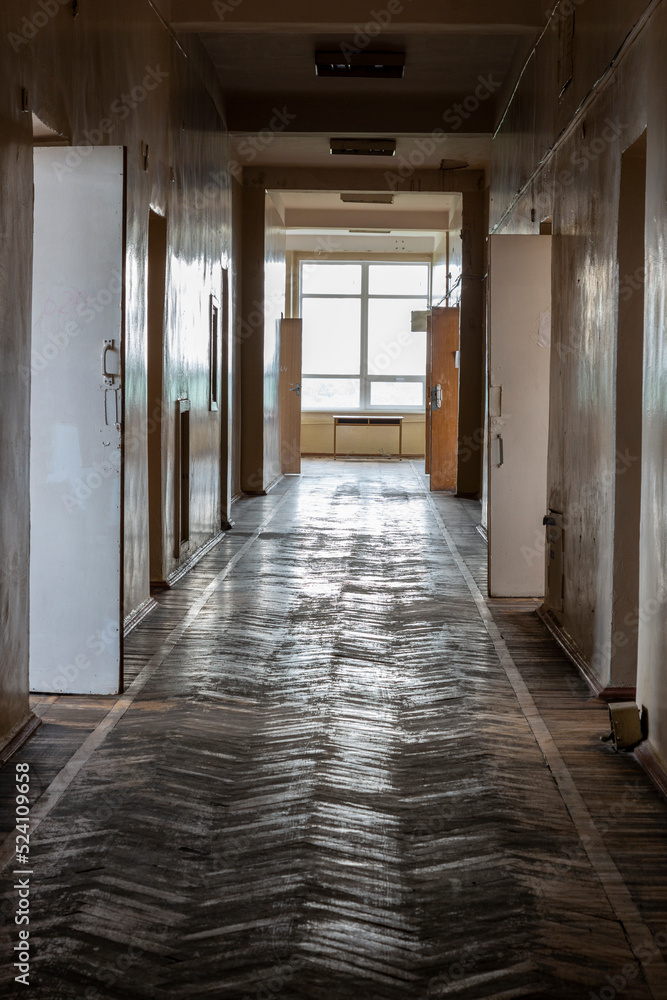 A fragment of a corridor with open doors to rooms