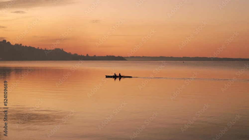 Couple in Kayak at sunset in puerto varas chile Couple in Kayak at sunset in puerto varas chile