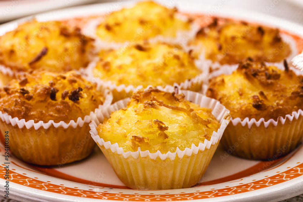 Queijadinha or queijada, sweet baked dessert from a traditional bakery and pastry shop from Brazil and Portugal, made with eggs, cheese or coconut, and lots of sugar. Queijadinha or queijada, sweet baked dessert from a traditional bakery and pastry shop from Brazil and Portugal, made with eggs, cheese or coconut, and lots of sugar.