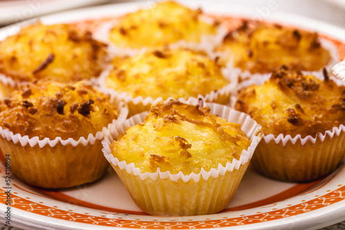 Queijadinha or queijada, sweet baked dessert from a traditional bakery and pastry shop from Brazil and Portugal, made with eggs, cheese or coconut, and lots of sugar.