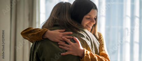 Картината върху платно Two girls hug and congratulate each other.