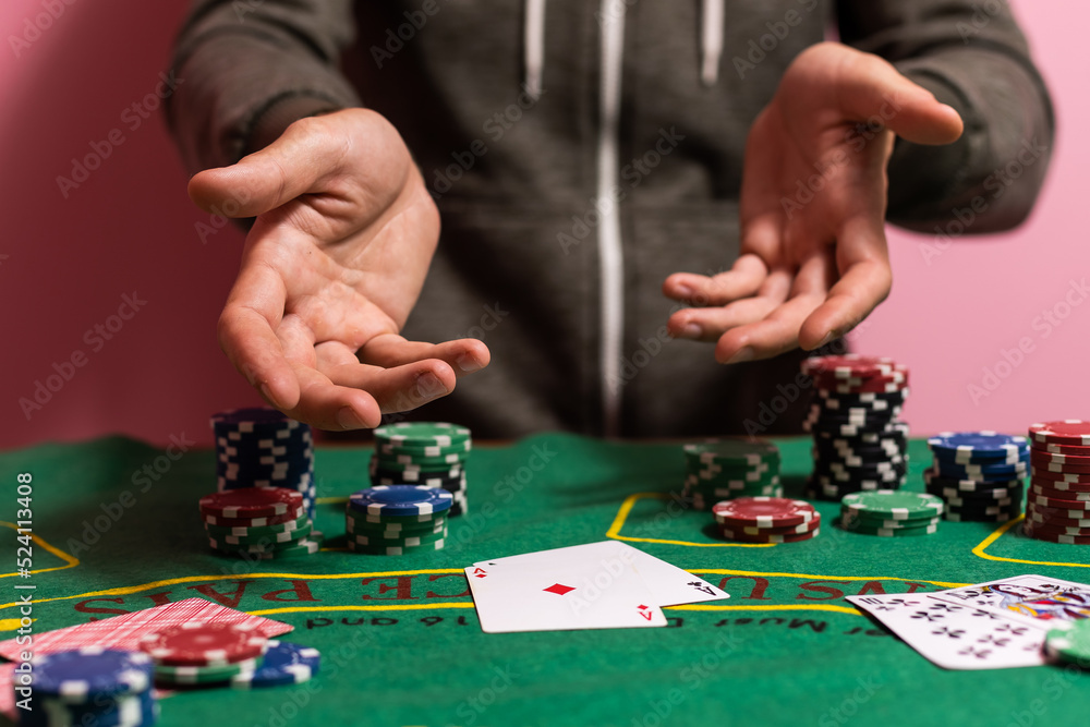 man playing blackjack at the table and betting chips man playing blackjack at the table and betting chips