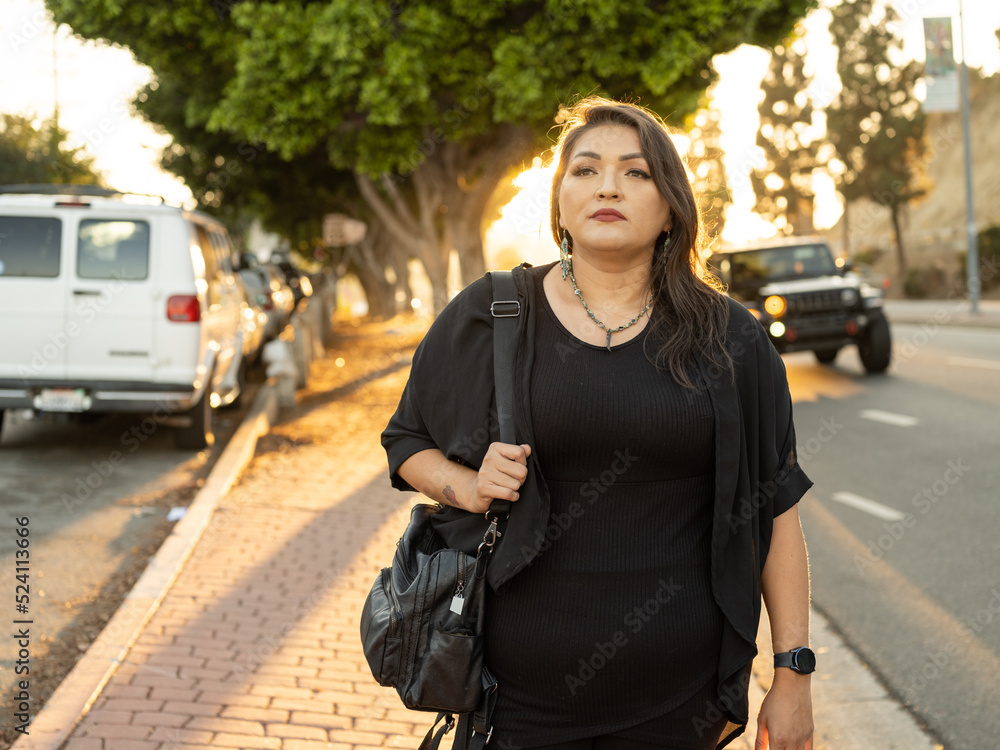 Fototapeta premium Native woman walking to work