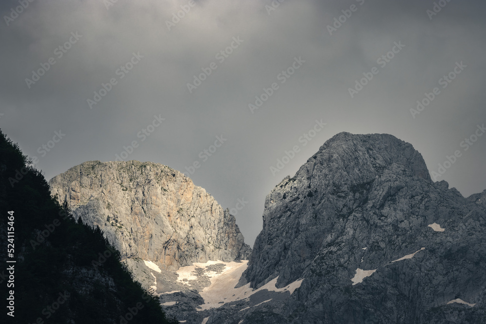epic mountain vista with dramatic storm light	