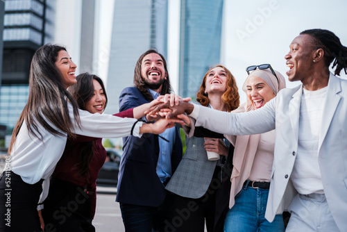 Canvas Print Group of businessmen celebrating the successes of the company outdoors in the fi