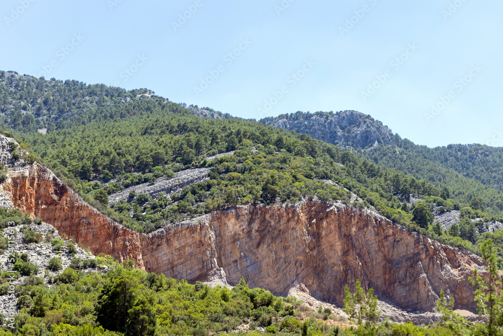 mountains, some of which have been shaved for the purpose of mining.