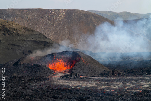 MERADALIR, ICELAND - AUGUST 14, 2022: A volcanic eruption has started at Fagradalsfjall in the Reykjanes peninsula. It attracts thousands of visitors every day who brave a daring hike to the crater.