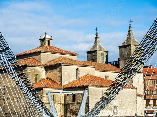 Panoramic view of the Collegiate Church of Santa María Magdalena from the suspension bridge of the city of Cangas de Narcea photo