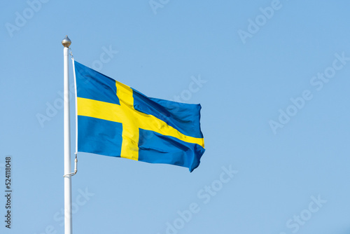 swedish flag on blue sky photo