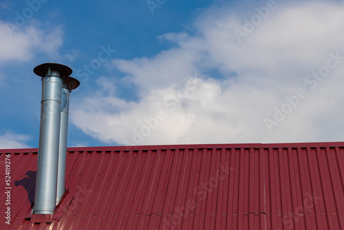 a chimney sticking out of an iron-clad roof