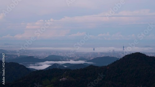 High angle lookout point view from Genting highland during beautiful night till sunrise overlooking the Kuala lumpur city centre photo