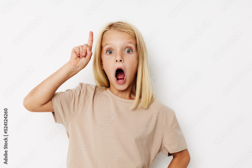 Beautiful little girl fashionable baby clothes posing studio