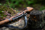 A Finnish rifle from the Second World War lies in the forest on the parapet of the trench. Weapons of the Finnish army. A wooden rifle with a bolt.