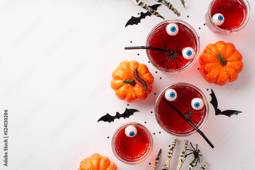 Halloween concept. Top view photo of floating eyeballs punch in glasses