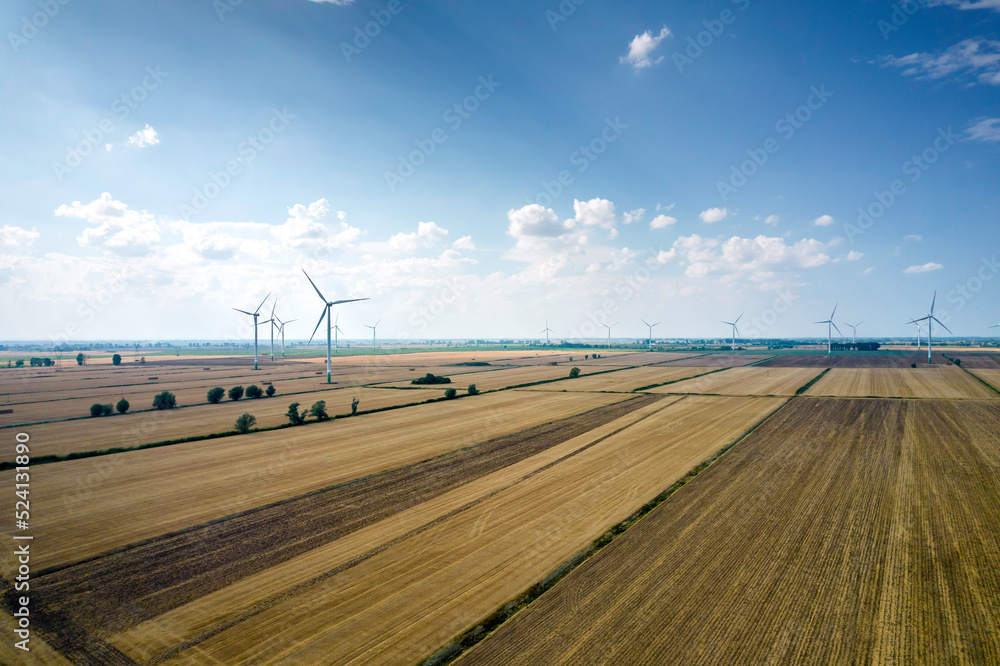 Wiejski krajobraz z wiatrakami. Energia odnawialna w Polsce. Prąd z wiatru. Elektrownia wiatrowa. - obrazy, fototapety, plakaty 