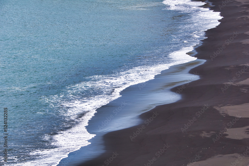 Reynisfjara - black beach in Iceland, close-up on waves Reynisfjara - black beach in Iceland, close-up on waves
