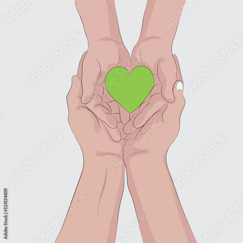 Father and son hand holding a green heart symbolic representation.
