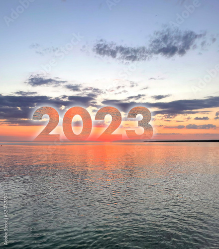 number 2023 on the ocean water horizon as the sign of new year