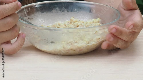 Wallpaper Mural the child eats porridge, healthy food, close up. happy baby sitting at the table in the kitchen and eating with an appetite Torontodigital.ca