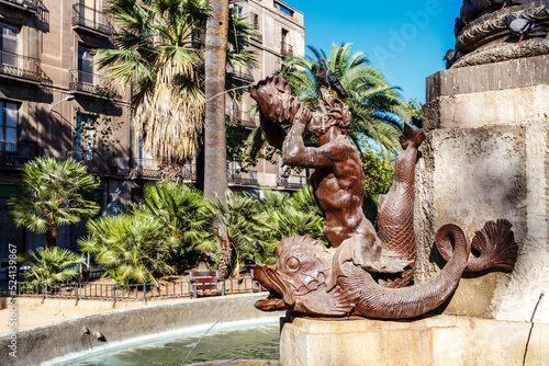 Tritons spouting water in a foutain below the Galceran Marquet monument in Barcelona, Catalonia, Spain, Europe photo